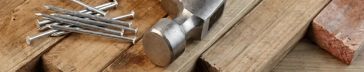 Hammer and nails on hardwood flooring boards in Gilbert, AZ