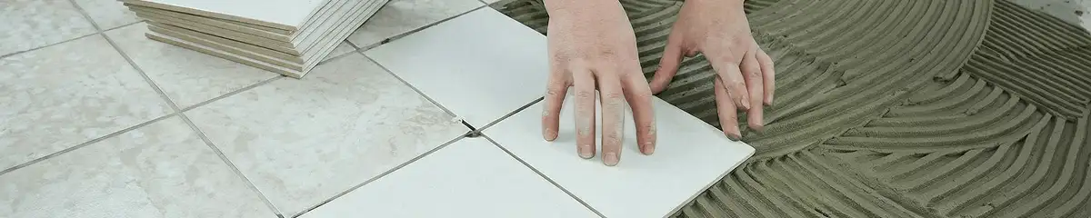 Professional installing white tile floors in Gilbert, AZ