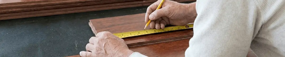 A professional installing wood flooring in Gilbert, AZ